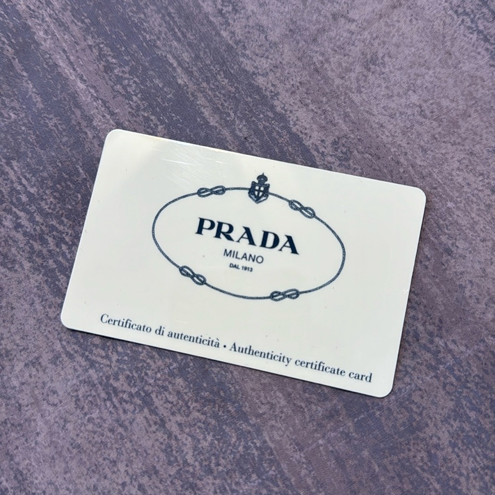 Prada card from a pair of vintage sunglasses. Hung onto this after glasses broke
